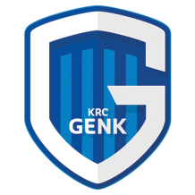 KRC Genk logo featuring a blue shield with vertical stripes and the text \"KRC Genk\" in the center.\n\nCaption: Disco
